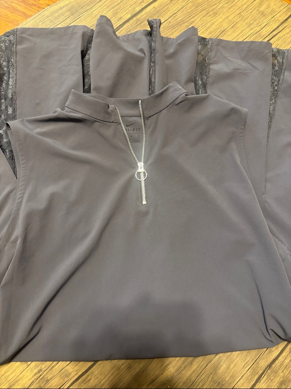 Nike Dri-FIT  dark colored sport dress with lace back and pleats.